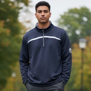 Greg Norman quarter zip pull over. Navy blue with white stripe